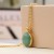 Golden Necklace with Faceted Green Resin Stone by Peace of Mind