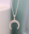 Sterling Silver Upside-Down Crescent Necklace with CZ Crystals by Peace of Mind